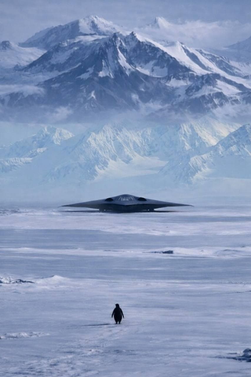 B-2 in Antarctica with lone penguin approaching